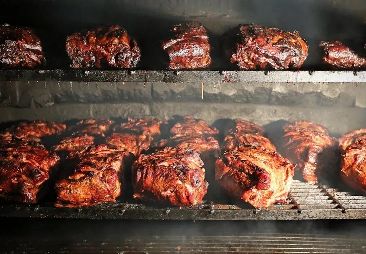 a bunch of different types of food on a grill